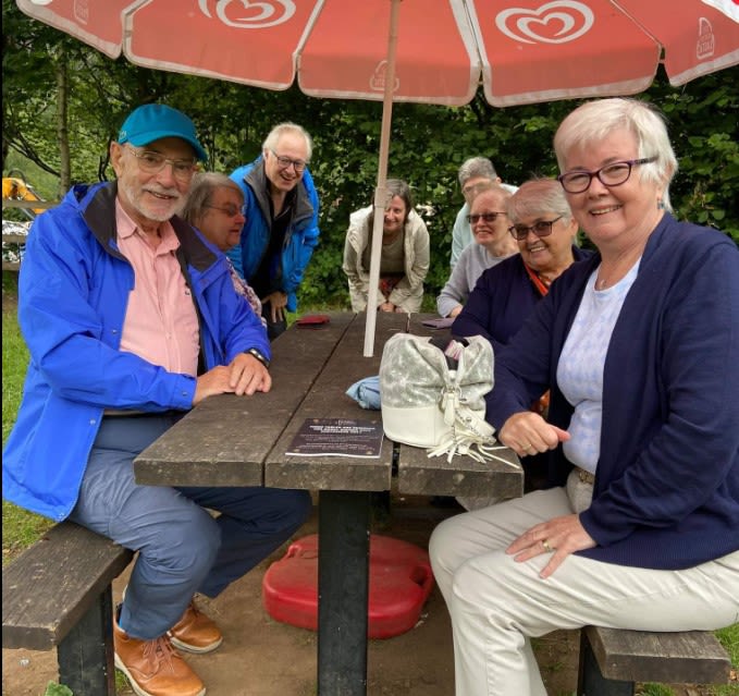Picture of group of people sitting outdoors