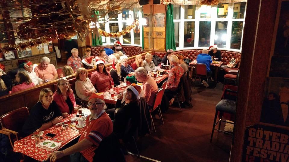 Picture of a group a people sitting at a table in a pub