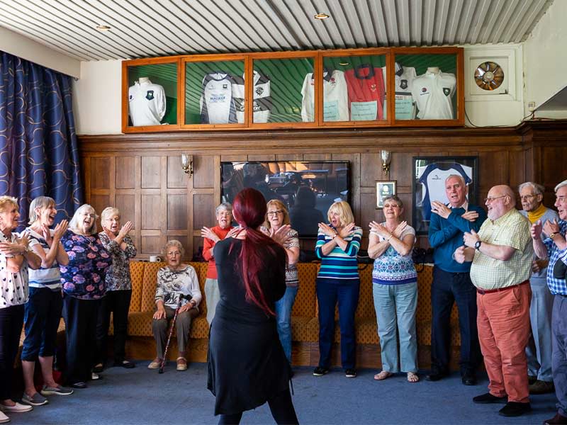 Picture of group of people singing in a choir