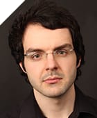 Headshot of man wearing glasses